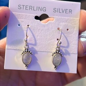 925 Sterling silver earrings with white oval stones. New on placard